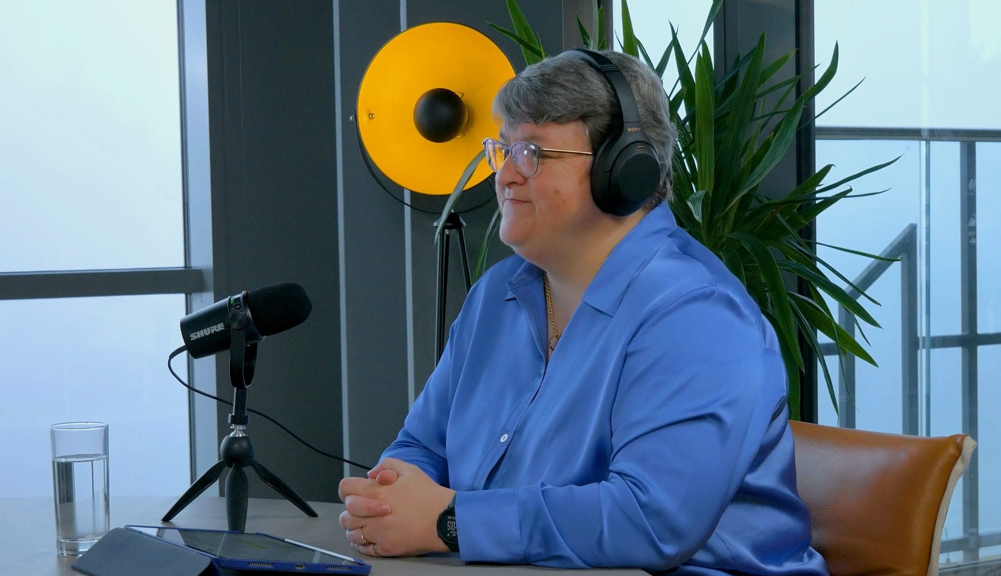 Podcast production setup with microphones around a table